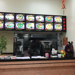 a restaurant counter and menus