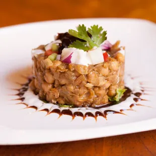 PAPDI CHAAT(V) spiced garbanzo beans, potatoes, crispy poories, homemade yogurt, tangy tamarind sauce