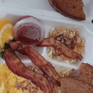 Scrambled eggs, bacon, hashbrowns with onions and rye toast.