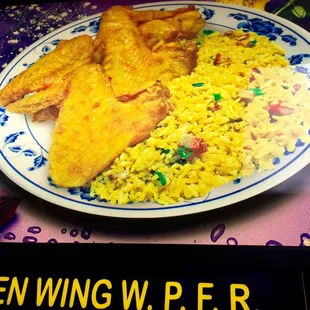 a plate of fried fish and rice