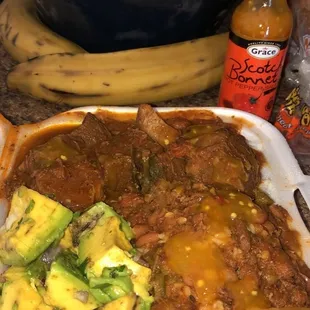 a plate of chili and vegetables