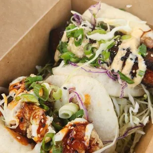 Spicy yoshi chicken bao and a pork belly bao