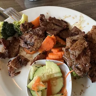 a plate of meat and vegetables