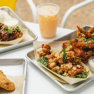 three trays of food on a table