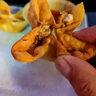 a person holding a pastry