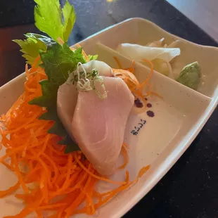 Two pieces of white tuna sashimi