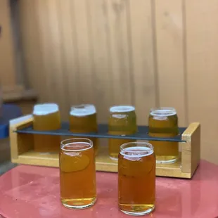 four glasses of beer on a table