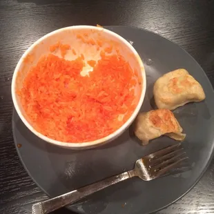 The orange chicken sauce mixed into white rice (which came with the orange chicken) in an attempt to make it taste good.