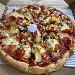 East of Chicago Pizza with pepperoni, banana peppers, mushrooms and onions.  Delish!!!