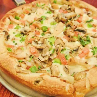 BBQ Chicken Pizza - BBQ sauce, grilled chicken, red onions, green peppers, tomatoes, and mushrooms