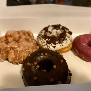 From L to R: peach fritter, chocolate malt with CBD, Oreo glaze, potato donut with blueberry glaze.