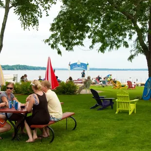 a group of people sitting at a picnic table