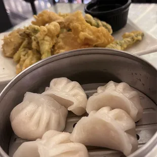 steamed dumplings in a steamer basket