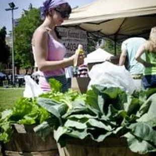 a woman selling vegetables