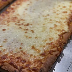 Cheesy Sicilian pizza pie