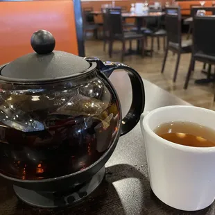 a cup of tea and a teapot