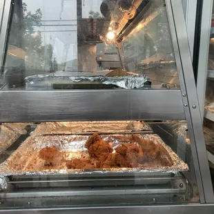a tray of fried chicken in an oven