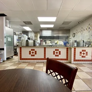 a kitchen with a table and chairs