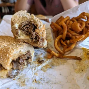 Balboa Beefsteak. $14.95. Comes with two kids of cheese, American and mozzarella. Side of curly fries. $4.95.