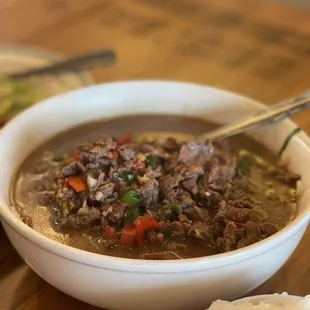 a bowl of soup and a plate of rice