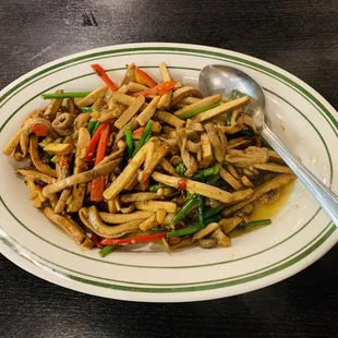 a plate of food with a spoon