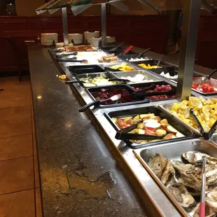 a variety of food in a buffet