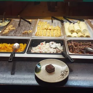 Half of the dessert buffet bar and other half is salad bar