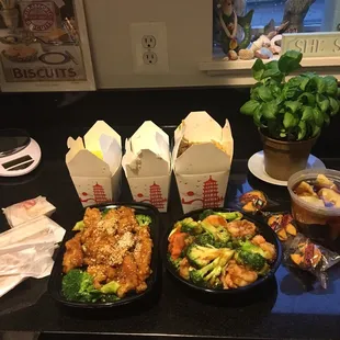 Pictured left to right: sesame chicken, shrimp and broccoli, wonton soup. Above is the rice and lo mein