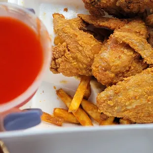 Wings, fries, mumbo sauce...I had already eaten most of my fries lol The food was nice and hot!