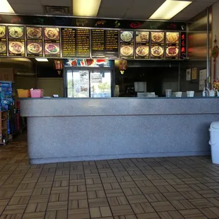 a restaurant counter with menus