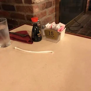 a glass of water and a bottle of coffee