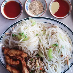 4 item combination dinner with veggie chow mein, veggie fried rice and sweet &amp; sour chicken. Best chinese food around town!