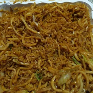 a take out container of noodles