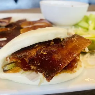 2/2 Peking duck course: crispy skin in bun with green onion and hoisin sauce in a bao bun. $48