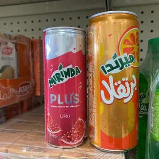 a variety of sodas on a shelf