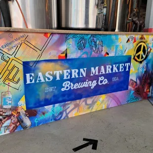 a sign for eastern market brewing co