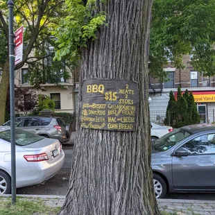 a sign on a tree