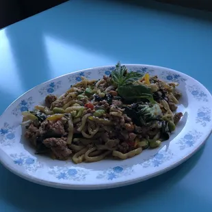 Vietnamese wok noodles with pork and basil.