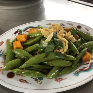 Spicy snap peas with tofu and crispy shallots