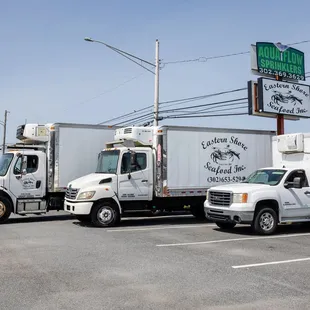 two trucks parked in a parking lot
