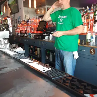 a man standing at a bar