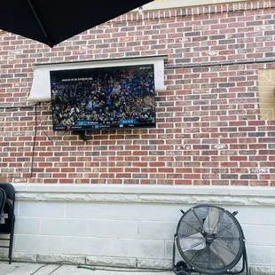 Two TVs on the patio for sports