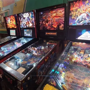 a row of pinball machines