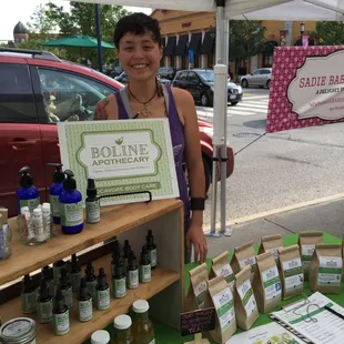 a woman standing in front of a display of organic products