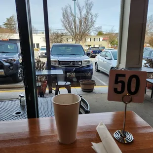 Waiting for food to be brought out &amp; watching the world go by.
