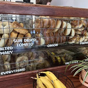 a display of bagels and bananas