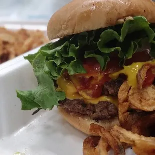 Double cheeseburger, curly fries and home made onion rings.
