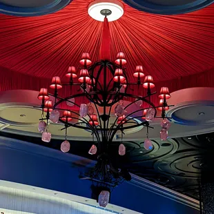 a chandelier with red lights