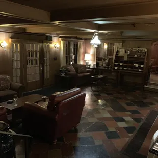 a living room and dining area of a hotel