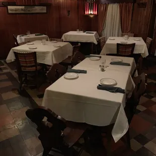 a dining room with tables and chairs